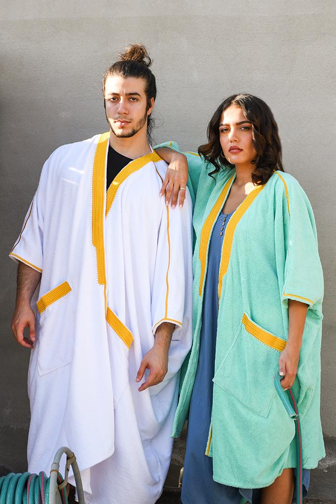 Woman wearing Beach Bisht classic bathrobe aqua green color small size men wearing bathrobe white color medium size from terry towel beach cover up collections