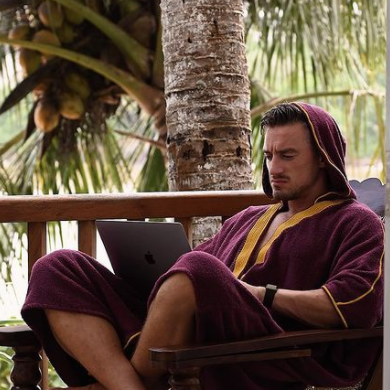 Pete Kaminski wearing Beach Bisht® hoodie bathrobe plum color from beach bisht terry towel beach cover up kimono collections Pete Kaminski wearing Beach Bisht® hoodie bathrobe plum color from beach bisht terry towel beach cover up kimono collections